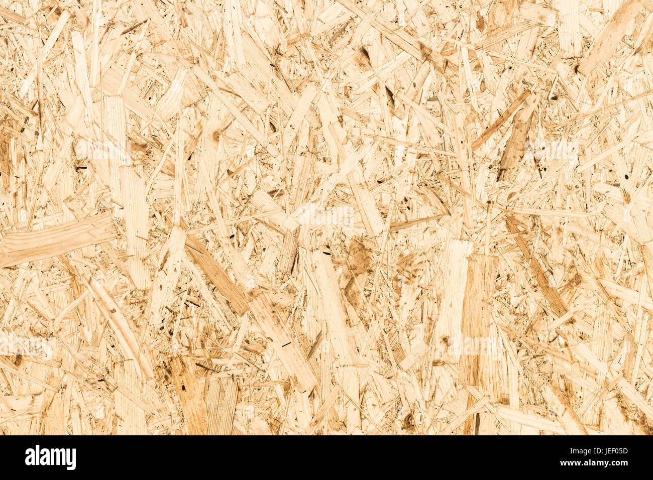 The texture of the surface of the OSB panel as a background. Stock Photo