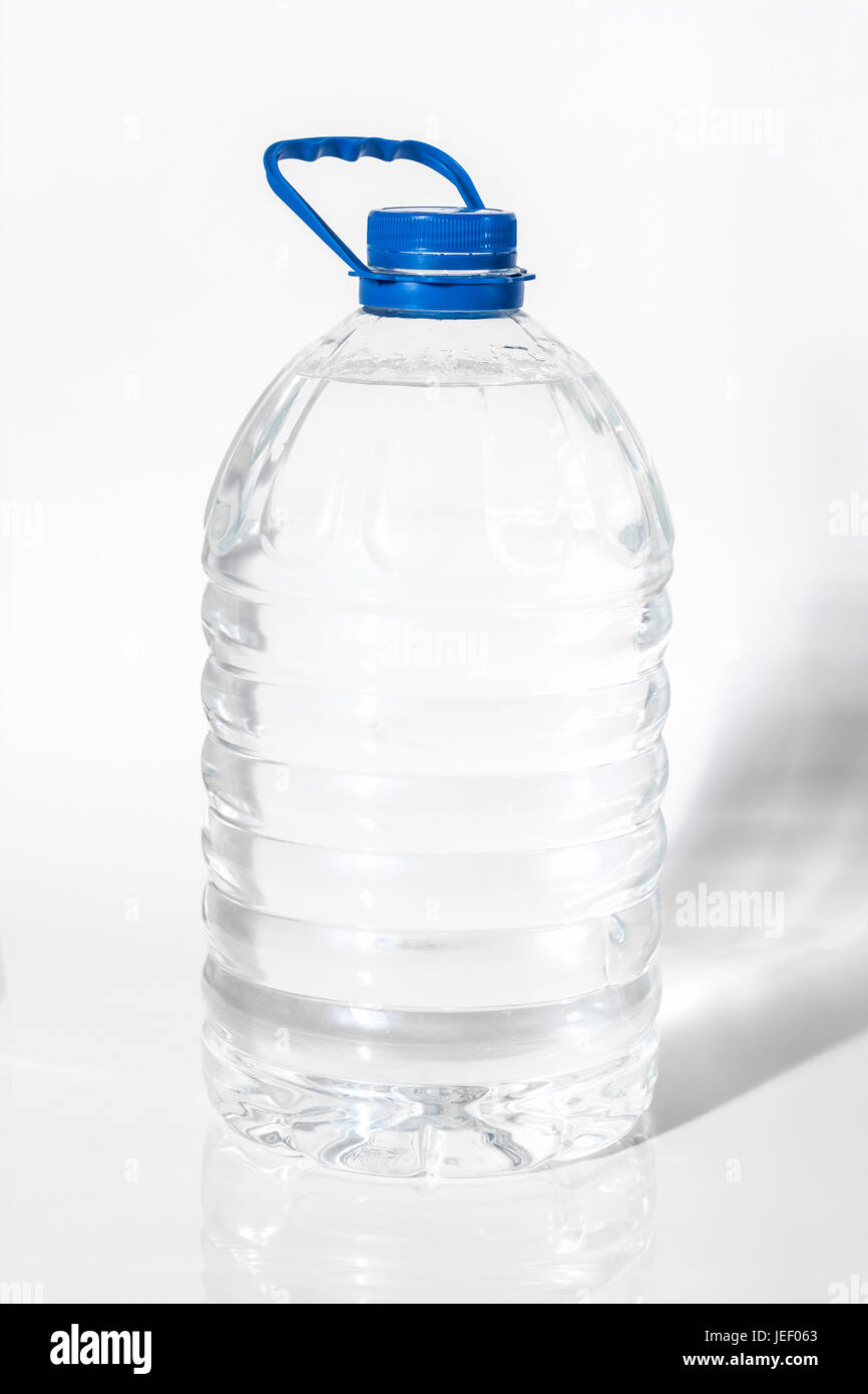Plastic container with water on the white background close-up. Stock Photo