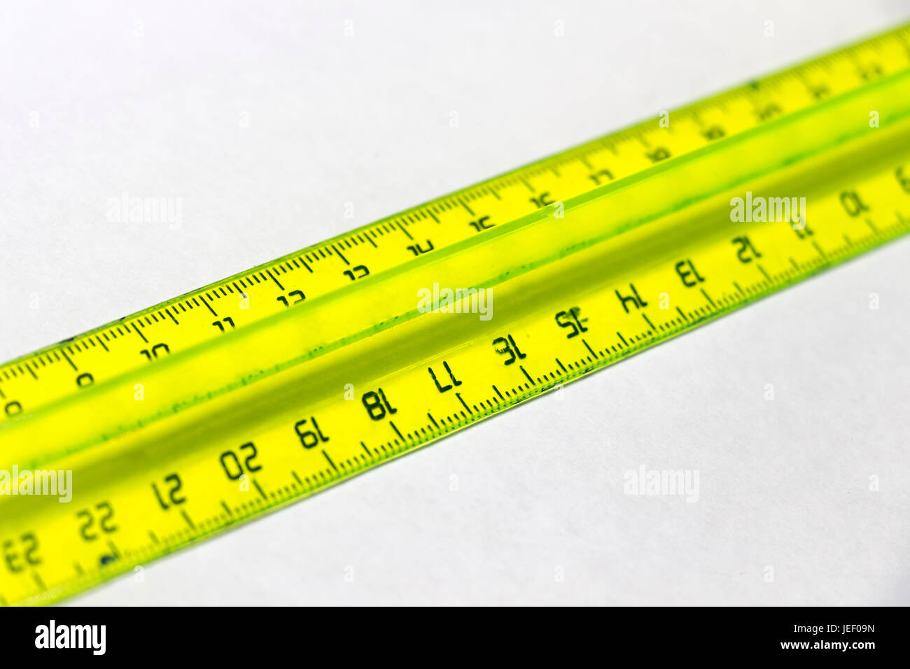Plastic pink ruler on white hi-res stock photography and images