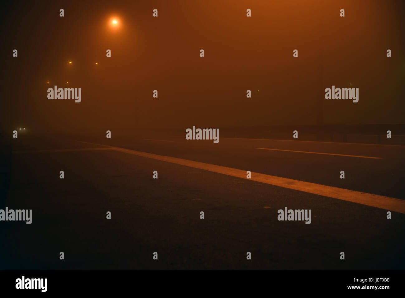 Night scene on the road with fog and car Stock Photo - Alamy