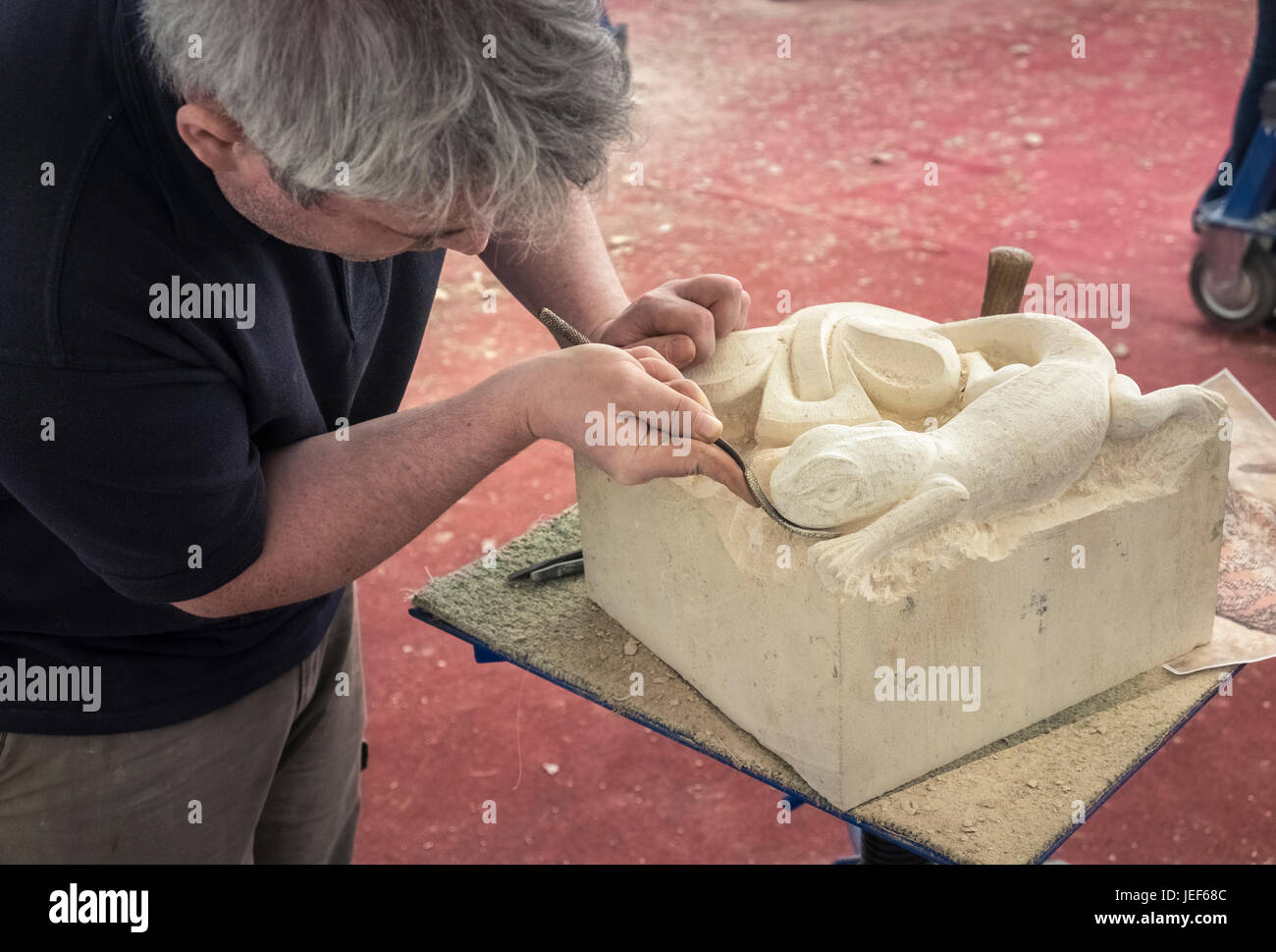 Stonemason demonstrating traditional skills at a heritage and craft event, City of Lincoln, Lincolnshire, England UK Stock Photo