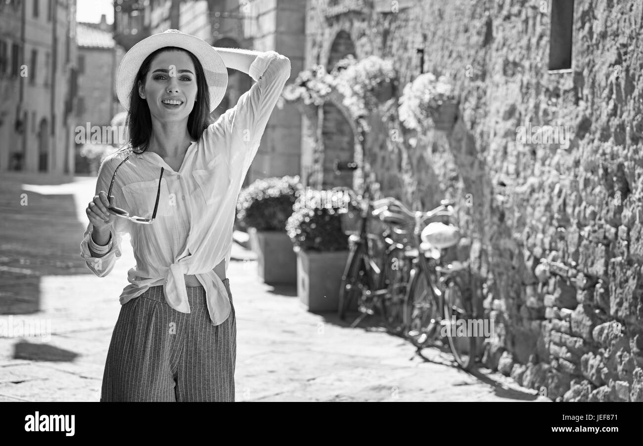 BW photography of a beautiful tourist woman. Italian holiday concept Stock Photo