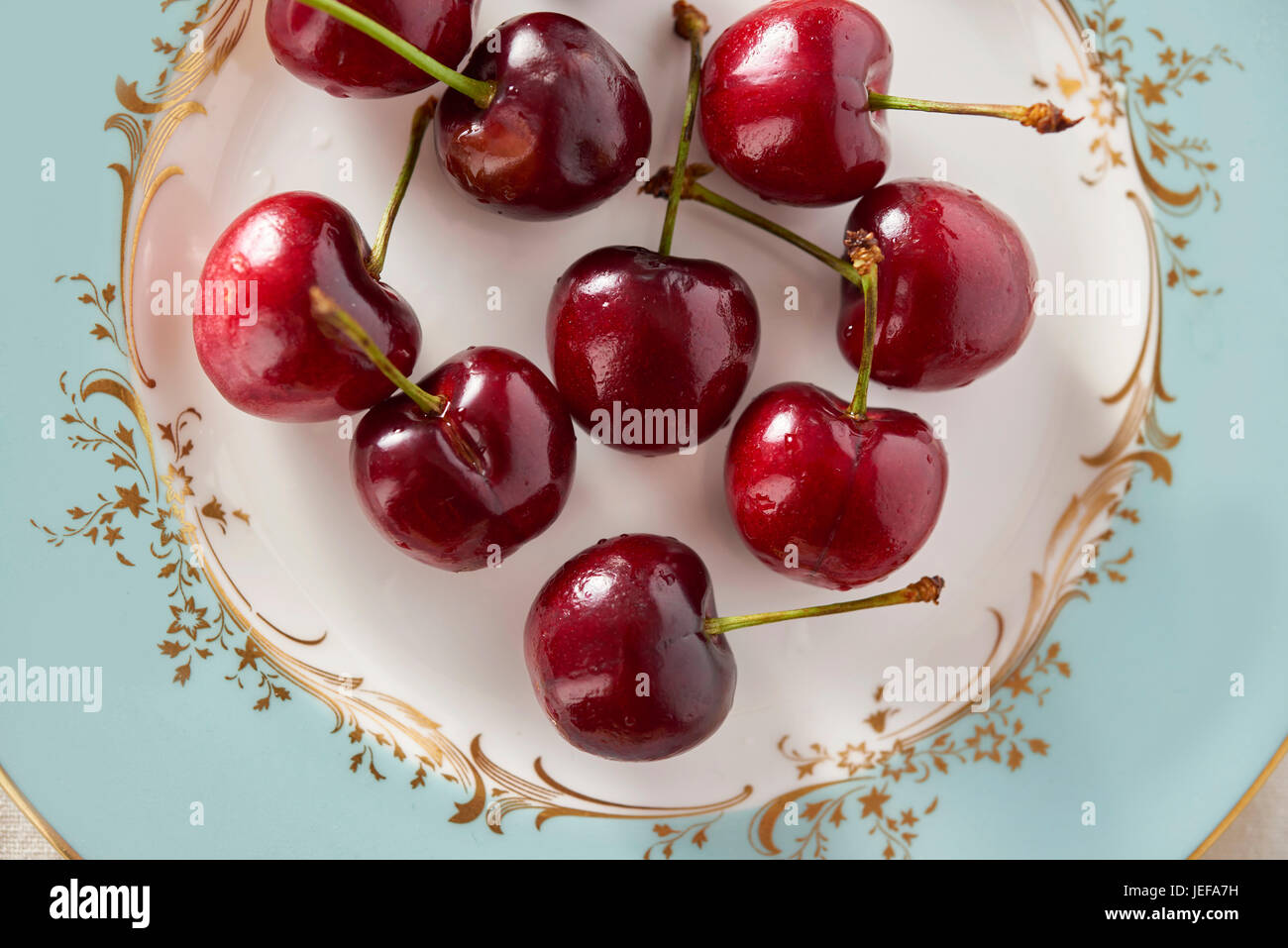 Fresh raw cherries on a plate Stock Photo