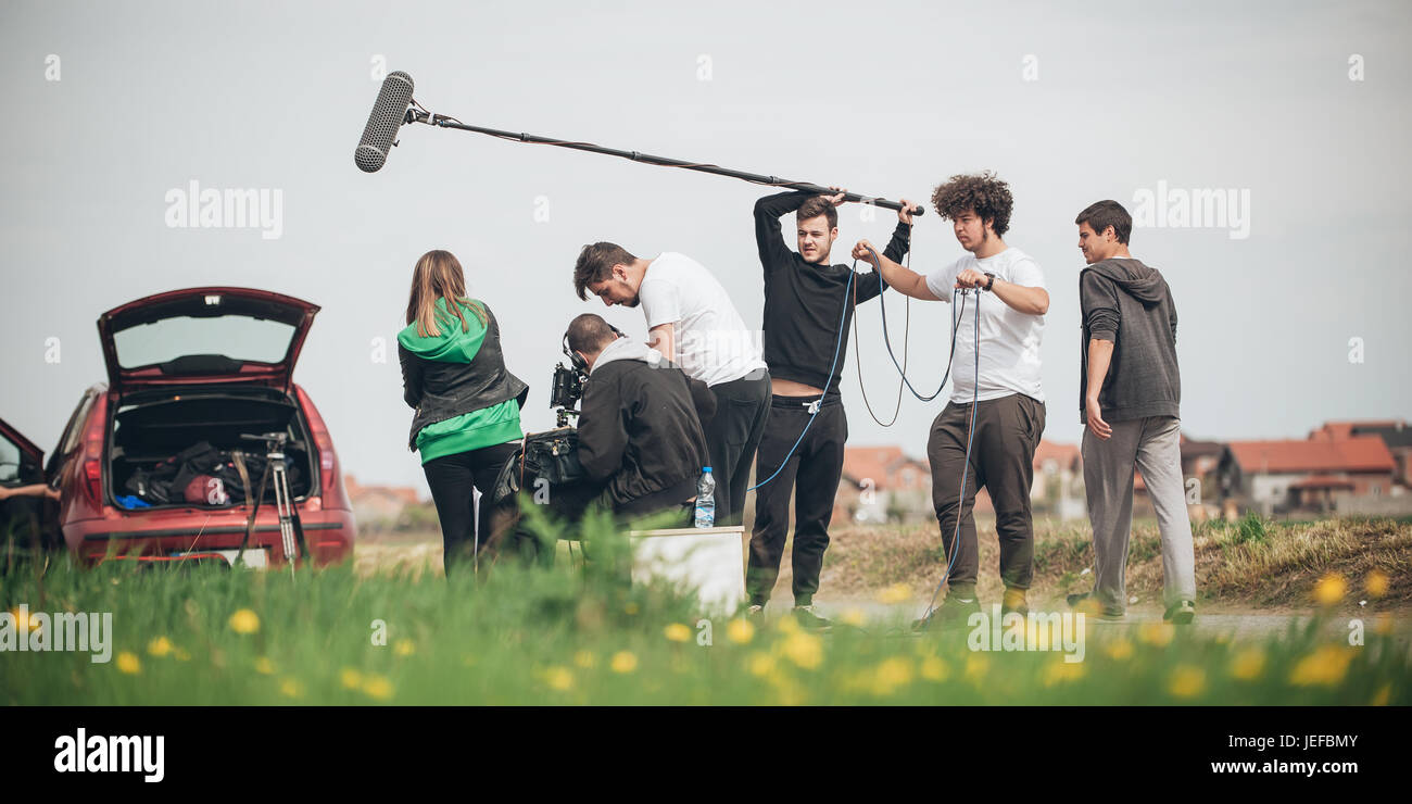 Behind the scene. Film crew team filming movie scene on outdoor