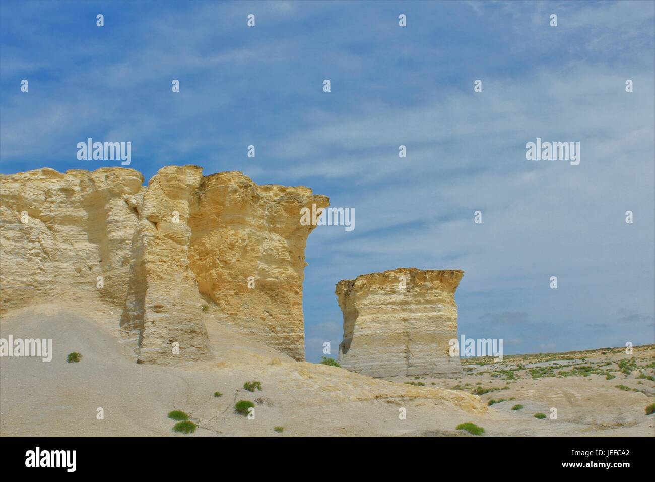Monument Rock in Western Kansas with blue sky and white clouds. Thats south of Oakley Kansas south of I 70. Stock Photo