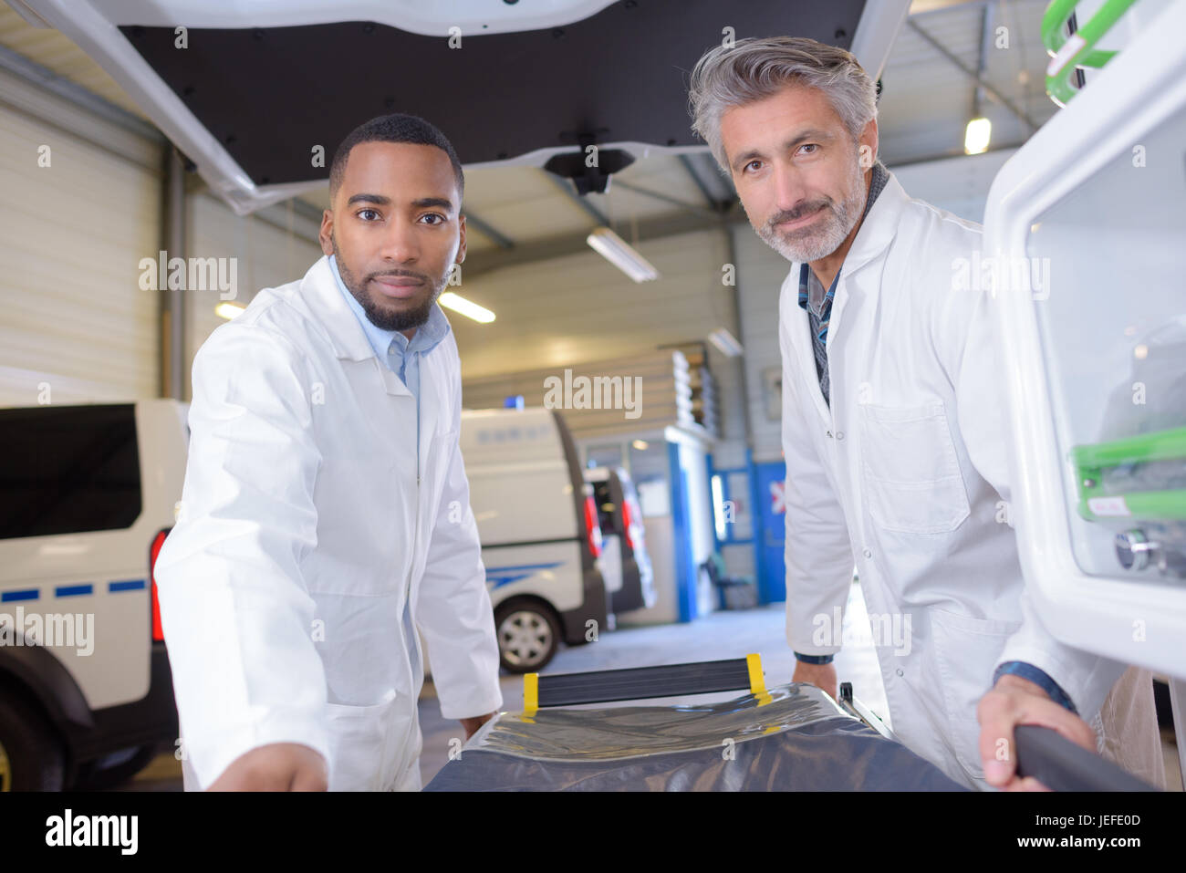 doctors moving a mobile medical bed Stock Photo Alamy