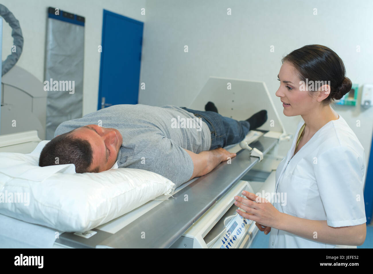 male patient ready to undergo mri assisted by doctors Stock Photo Alamy