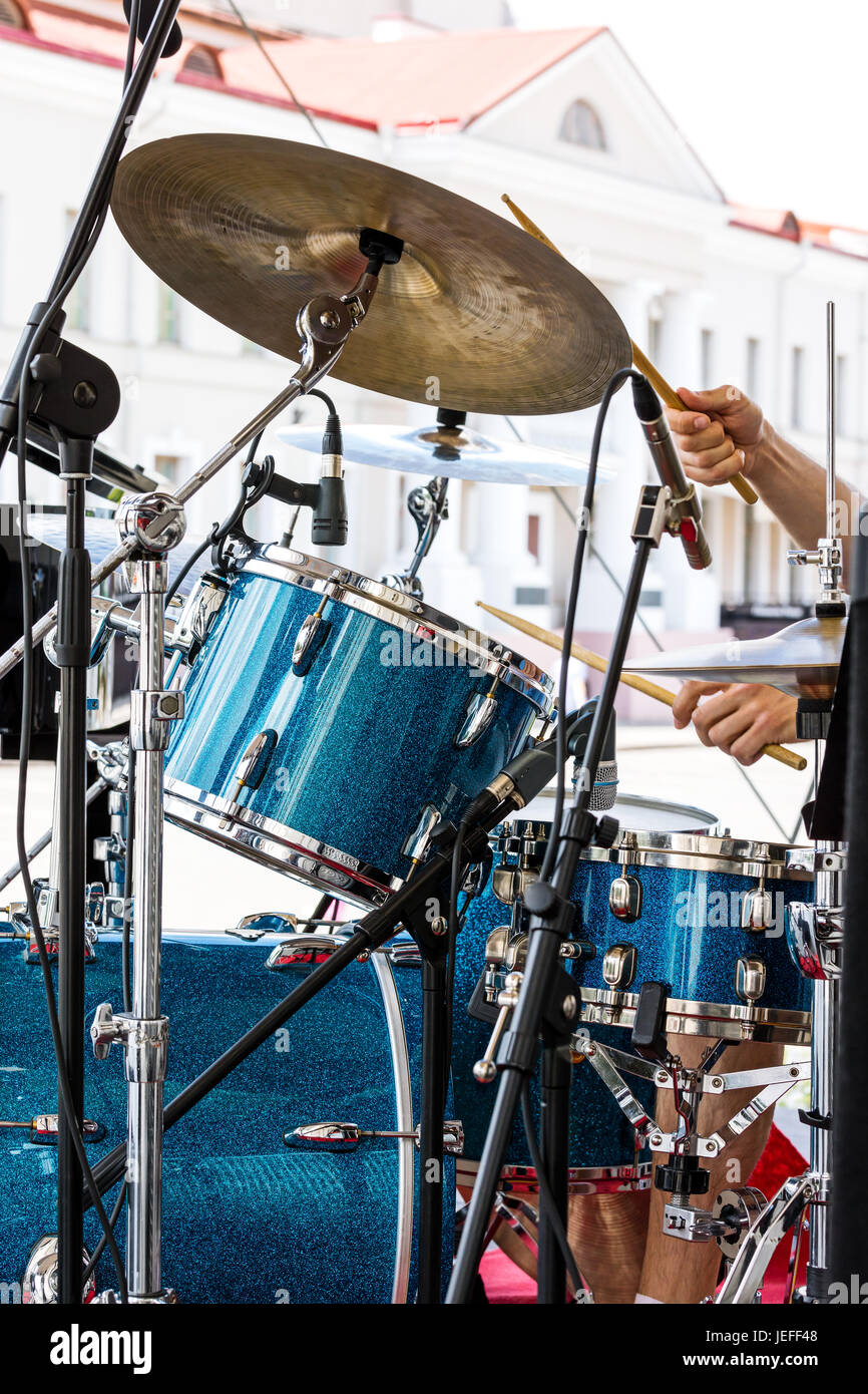 street musician playing drums outdoors with drumsticks in his hands Stock Photo Alamy