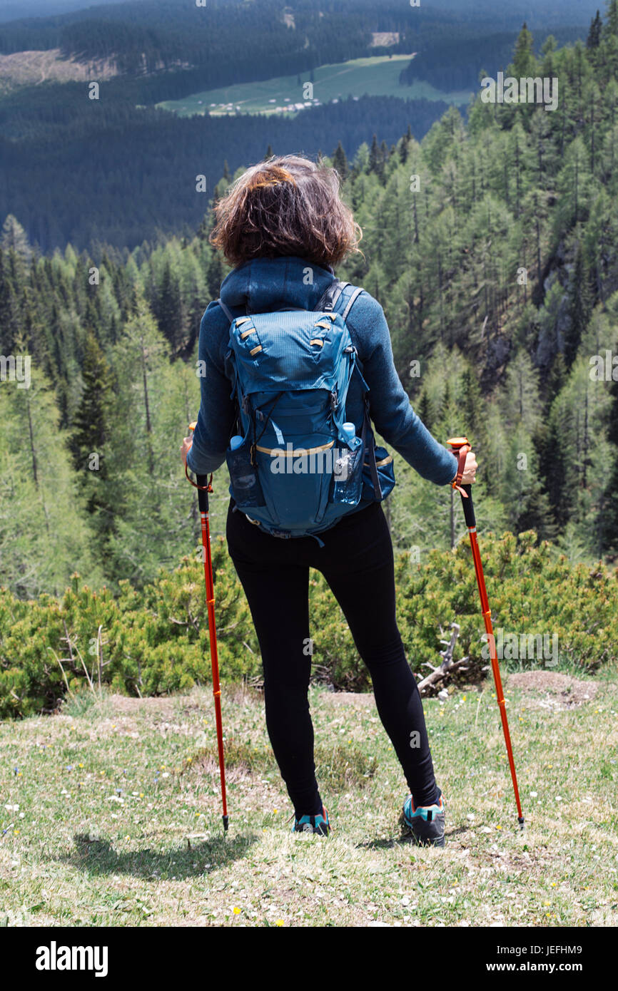 View at young woman hiking in mountain Stock Photo - Alamy