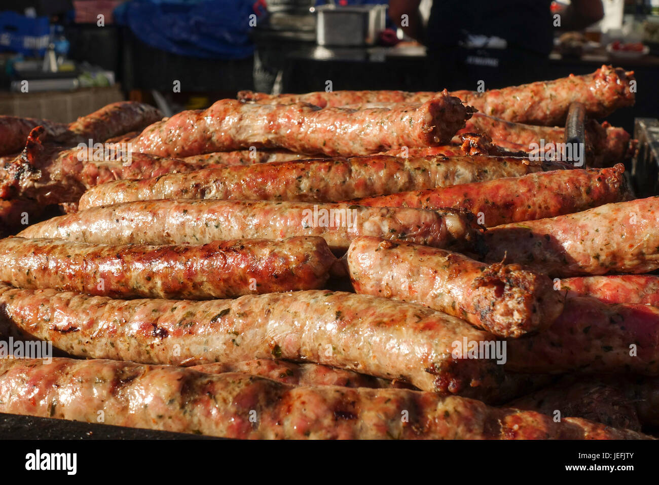 Argentinian barbecue, asado chorizo sausages cooking on, grill at a