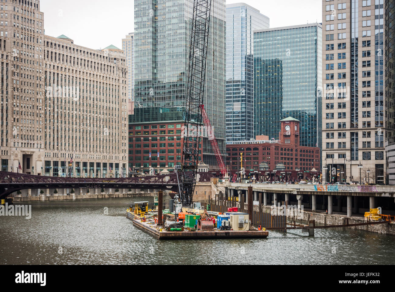 Barge transporting construction materials on the Chicago River Stock Photo