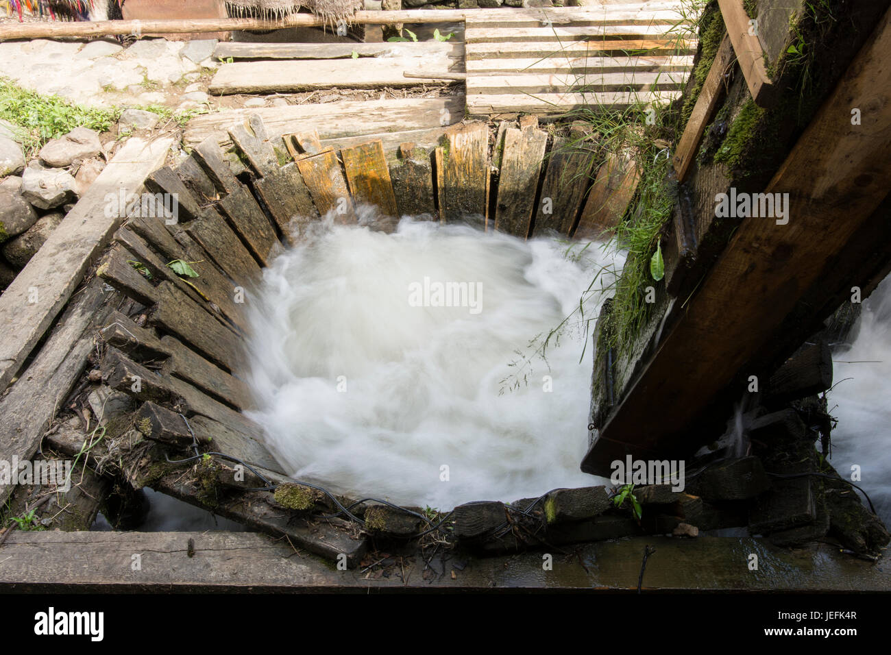 A traditional carpet washing machine in a river in the Maramures region Stock Photo