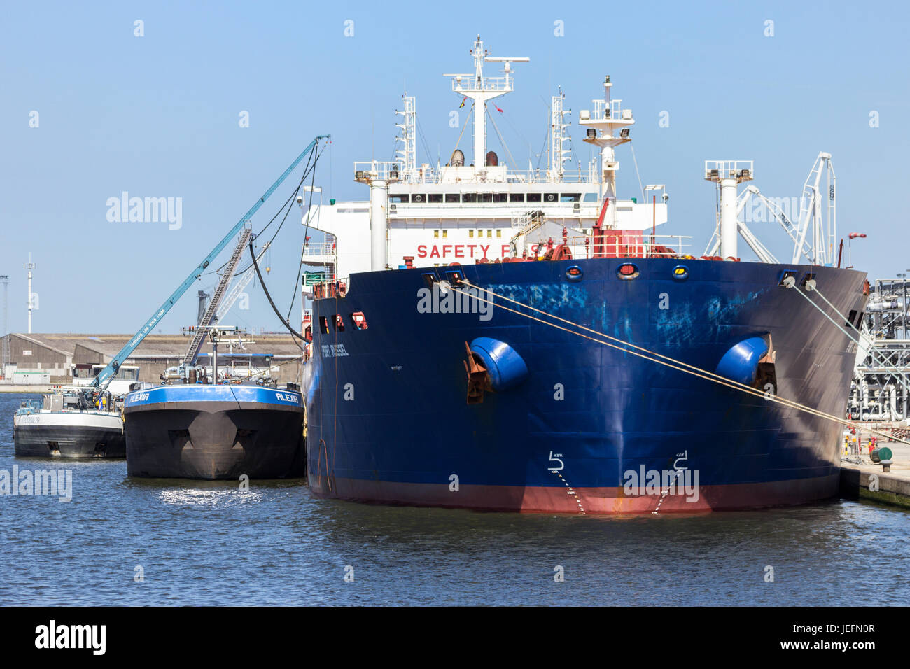 ANTWERP, BELGIUM - JUL 9, 2013: Oil tanker moored in the Port of Antwerp. Stock Photo