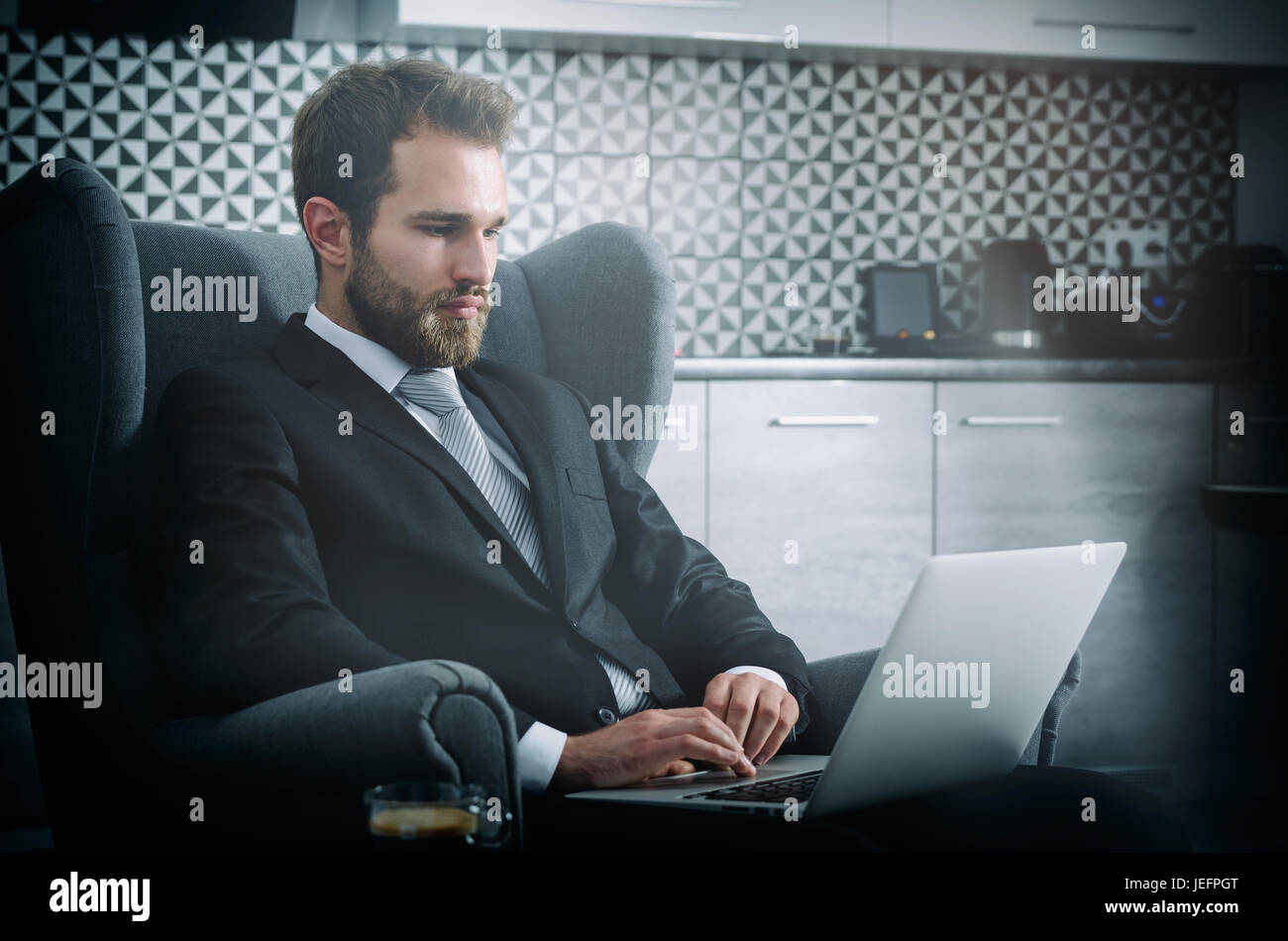 Young business man working from home with laptop. home computer businessman laptop concept Stock Photo
