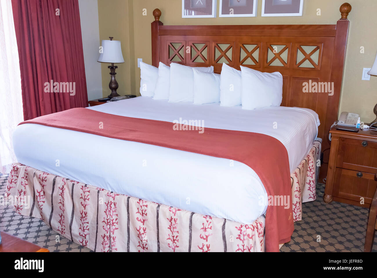 Beautiful Elevated King Sized Bed with Pillows Stock Photo Alamy