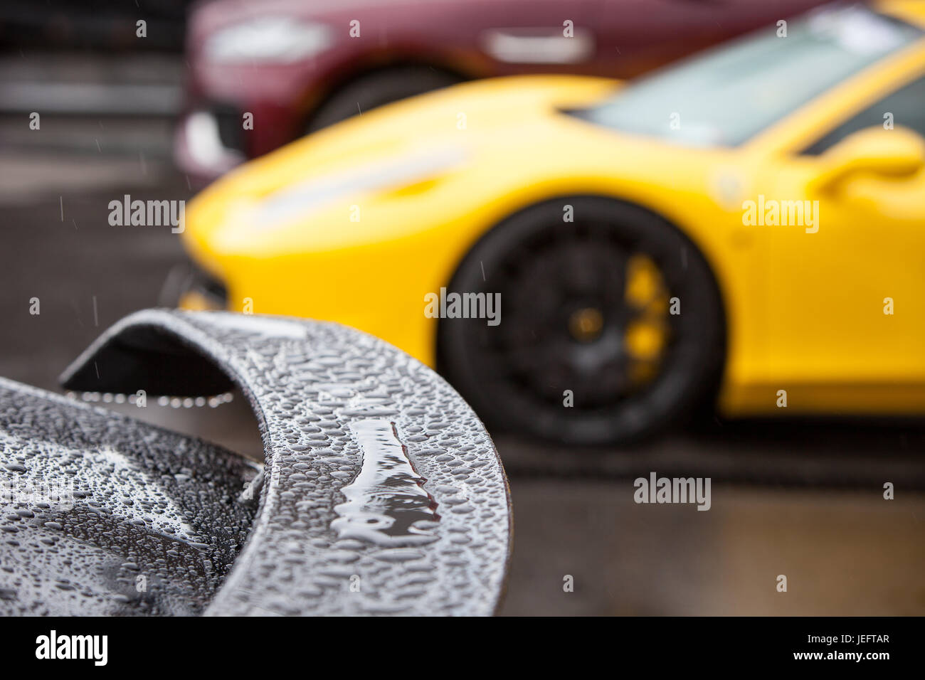 Rain drops on the spoiler of a sports car Stock Photo