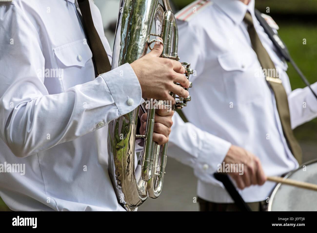 musician of military orchestra playing tuba during brass bands fest Stock Photo