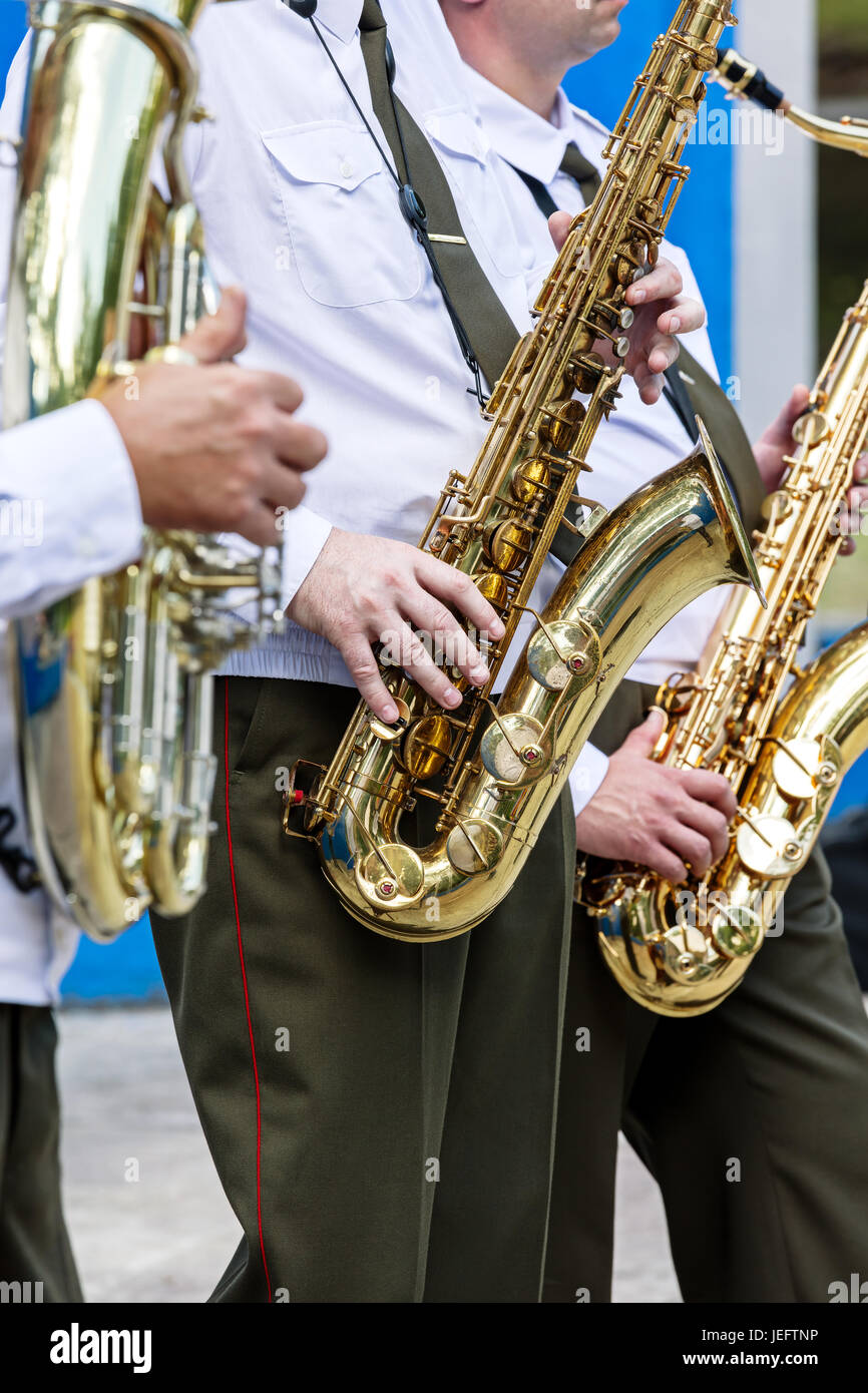 military orchestra musicians playing saxophones during brass bands fest