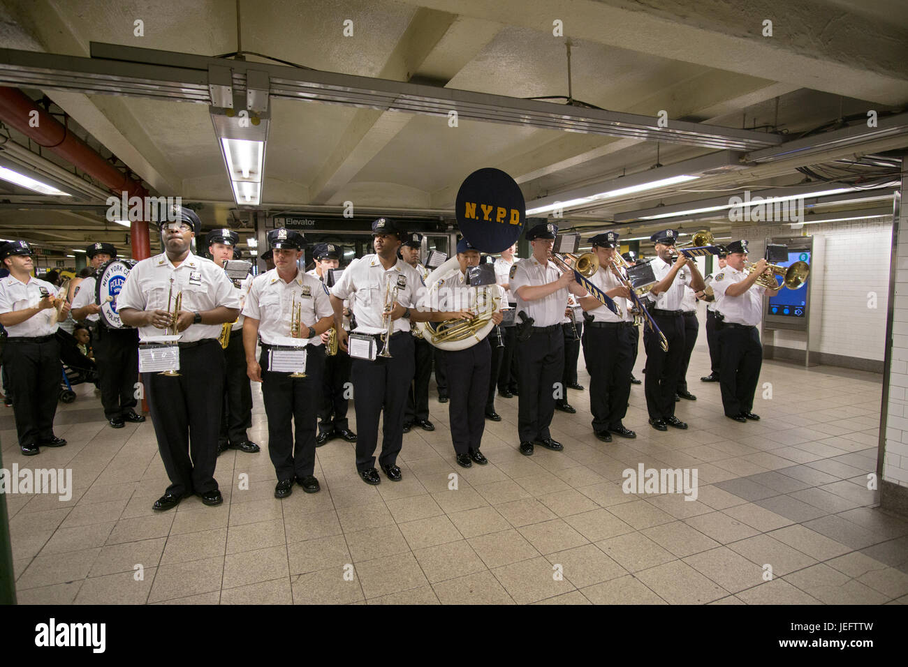The new York City Police Band performing underground in the Union Square subway station as part of a community outreach program. Manhattan, New York Stock Photo