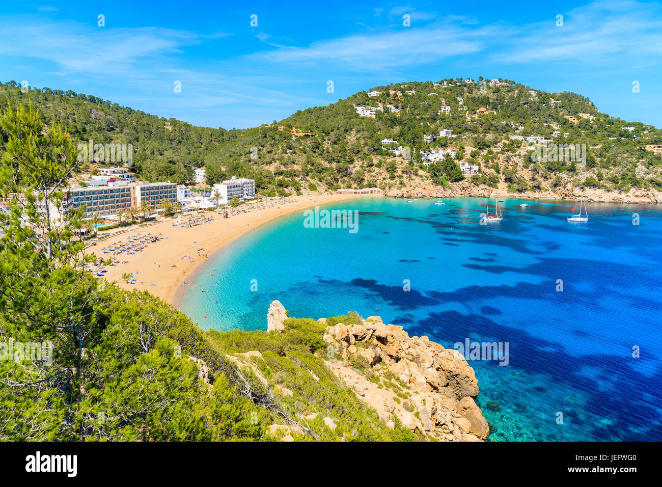 View of beautiful Cala San Vicente bay with azure sea water and beach