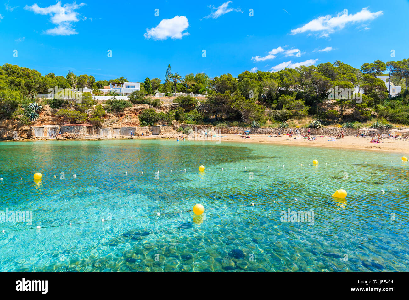 Turquoise crystal clear water of beautiful Cala Gracio beach, Ibiza island, Spain Stock Photo