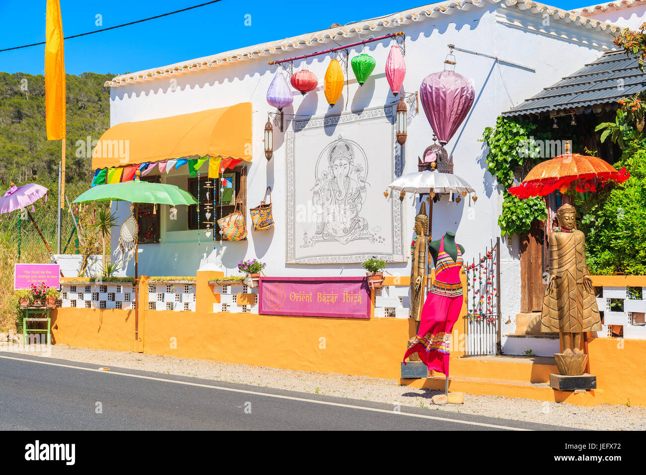 IBIZA ISLAND, SPAIN - MAY 20, 2017: Indian shop with clothes on street of Sant Carles de Peralta village on Ibiza island, Spain. Stock Photo