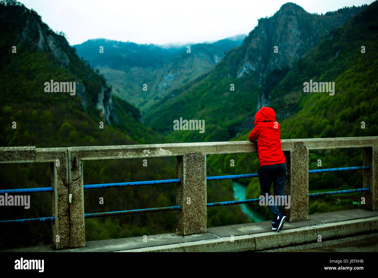 Hiker girl standing on bridge Stock Photo - Alamy