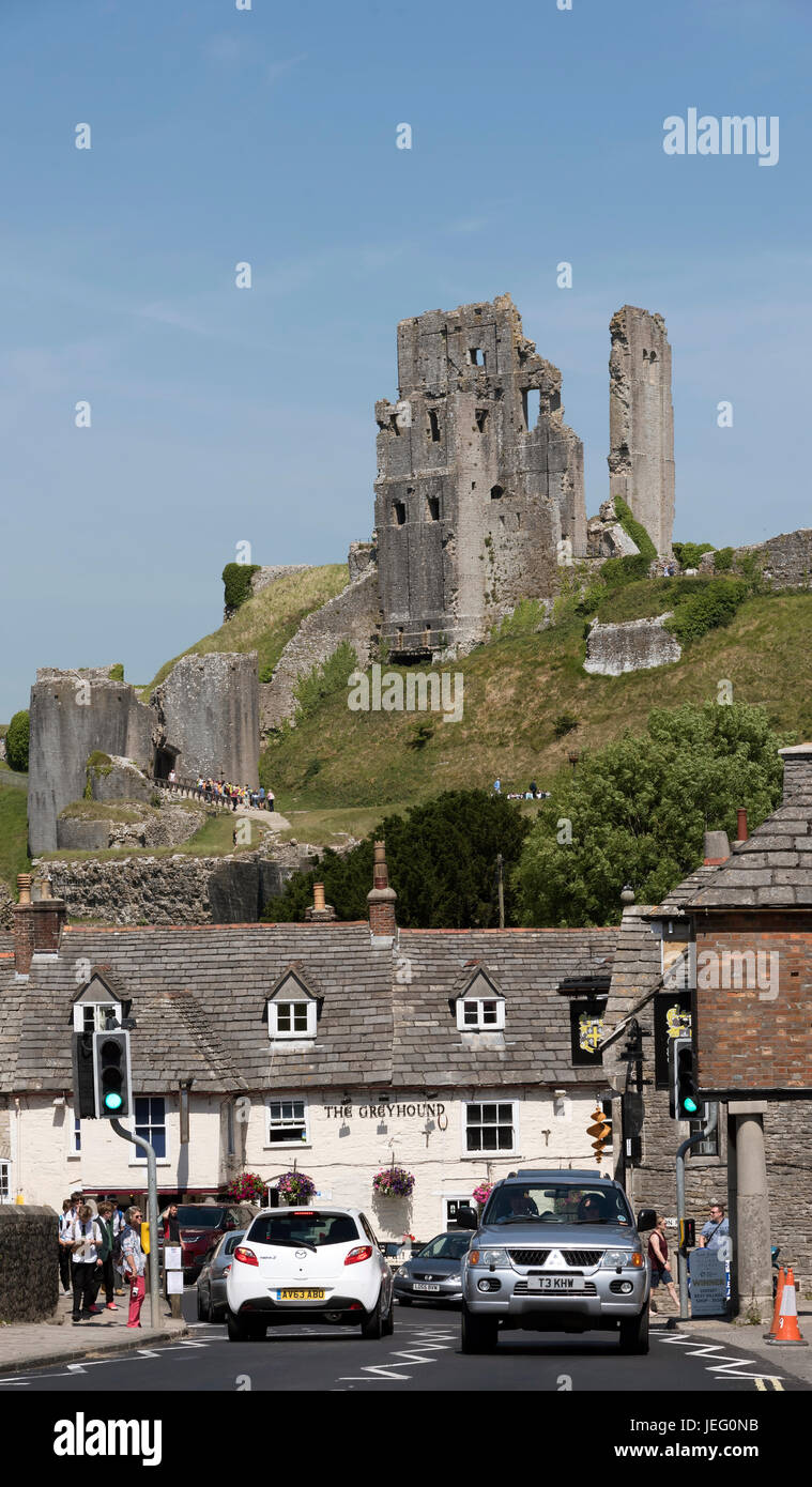 Corfe Castle overlooks the old Greyhound pub on the market square Corfe ...