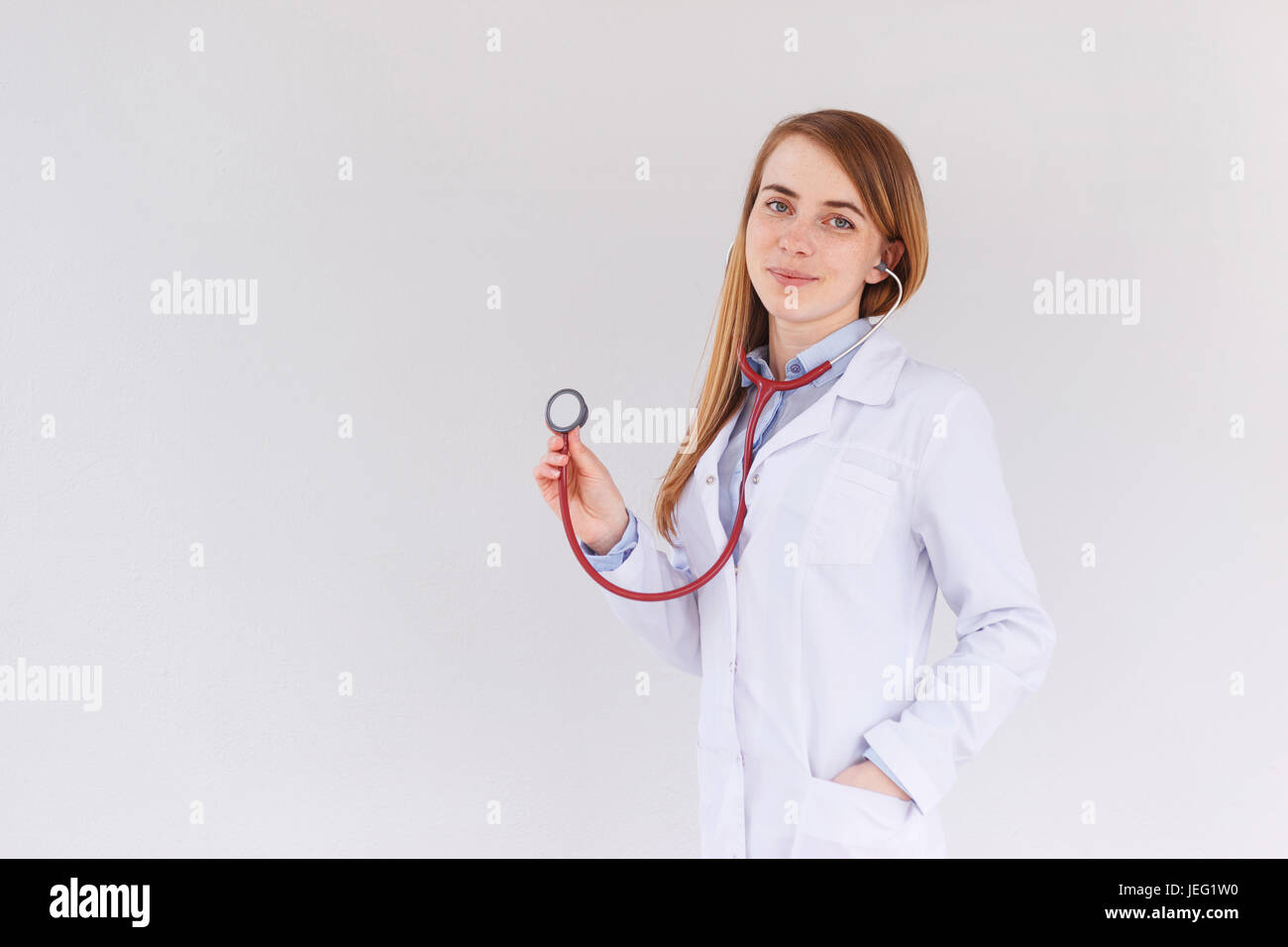 Portrait of female doctor using stethoscope Stock Photo - Alamy