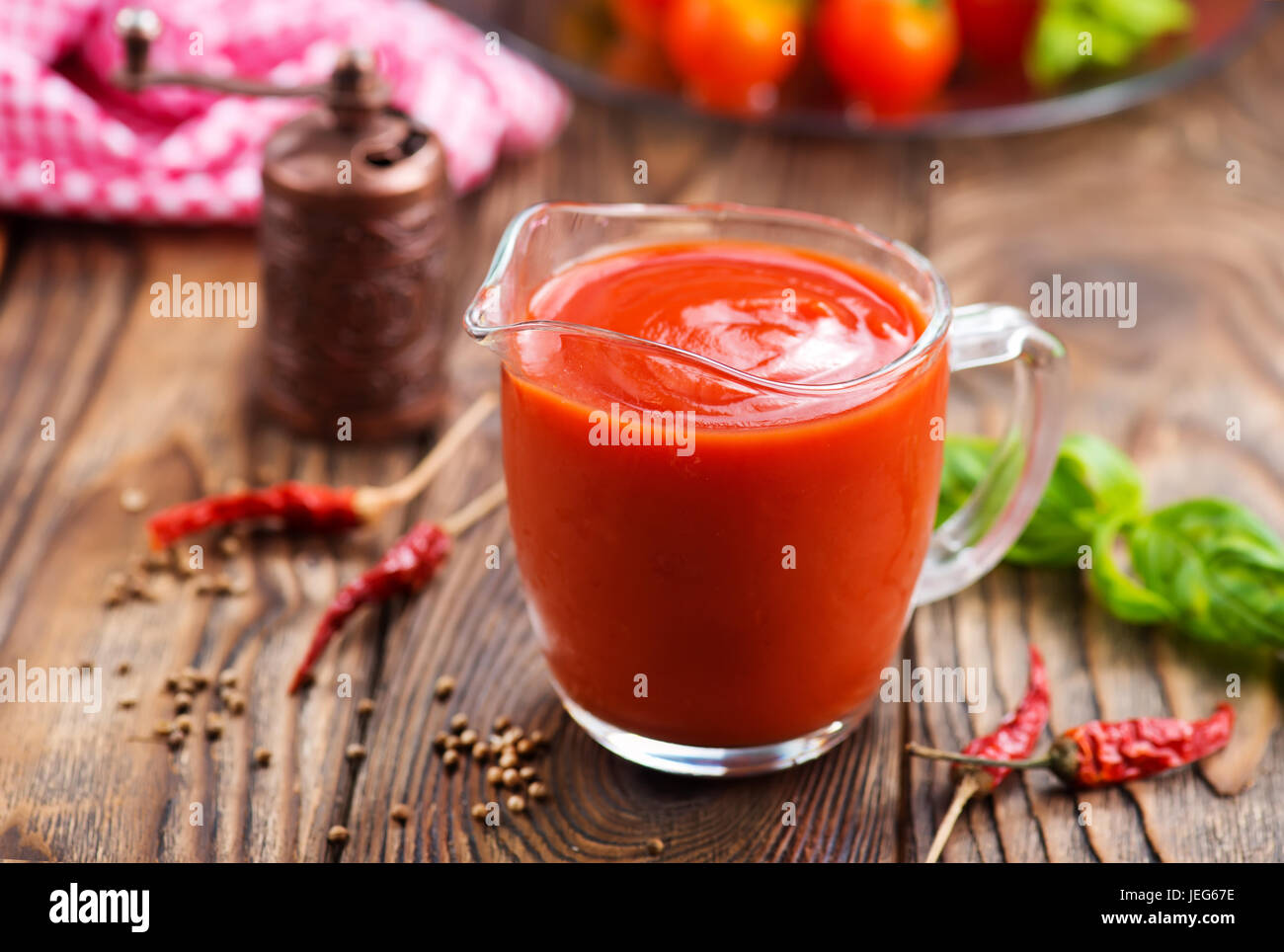 tomato sauce in glass jug and on a table Stock Photo - Alamy