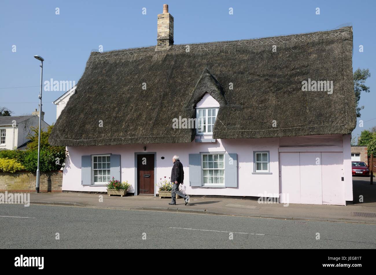 No 68 High Street, Great Shelford, Cambridgeshire, is timber-framed and plastered cottage with a thatched roof of mid-18th century date. Stock Photo