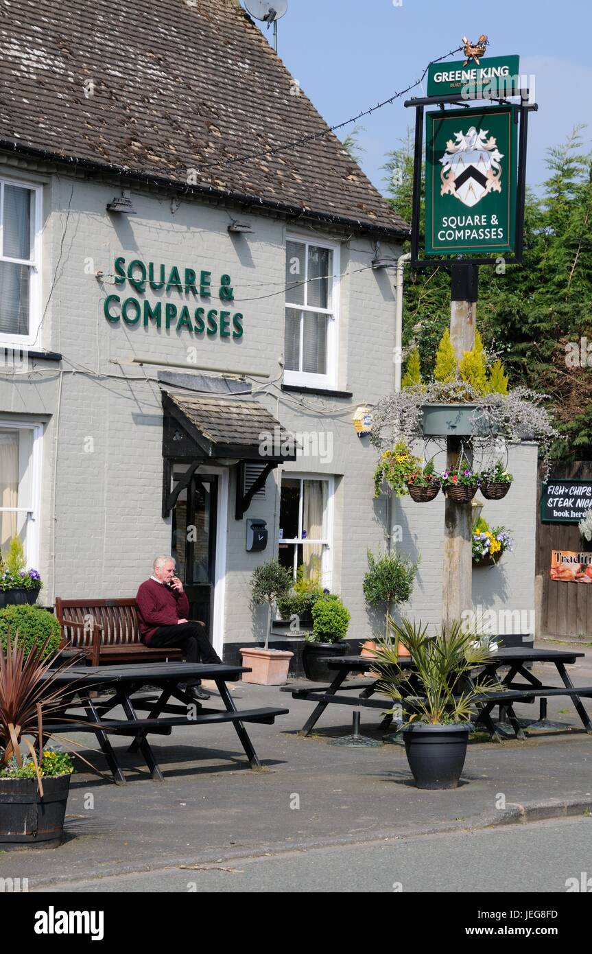 Square & Compasses, Great Shelford, Cambridgeshire, is a large 17th century timber-framed house, partly encased in brick around 1800. Stock Photo