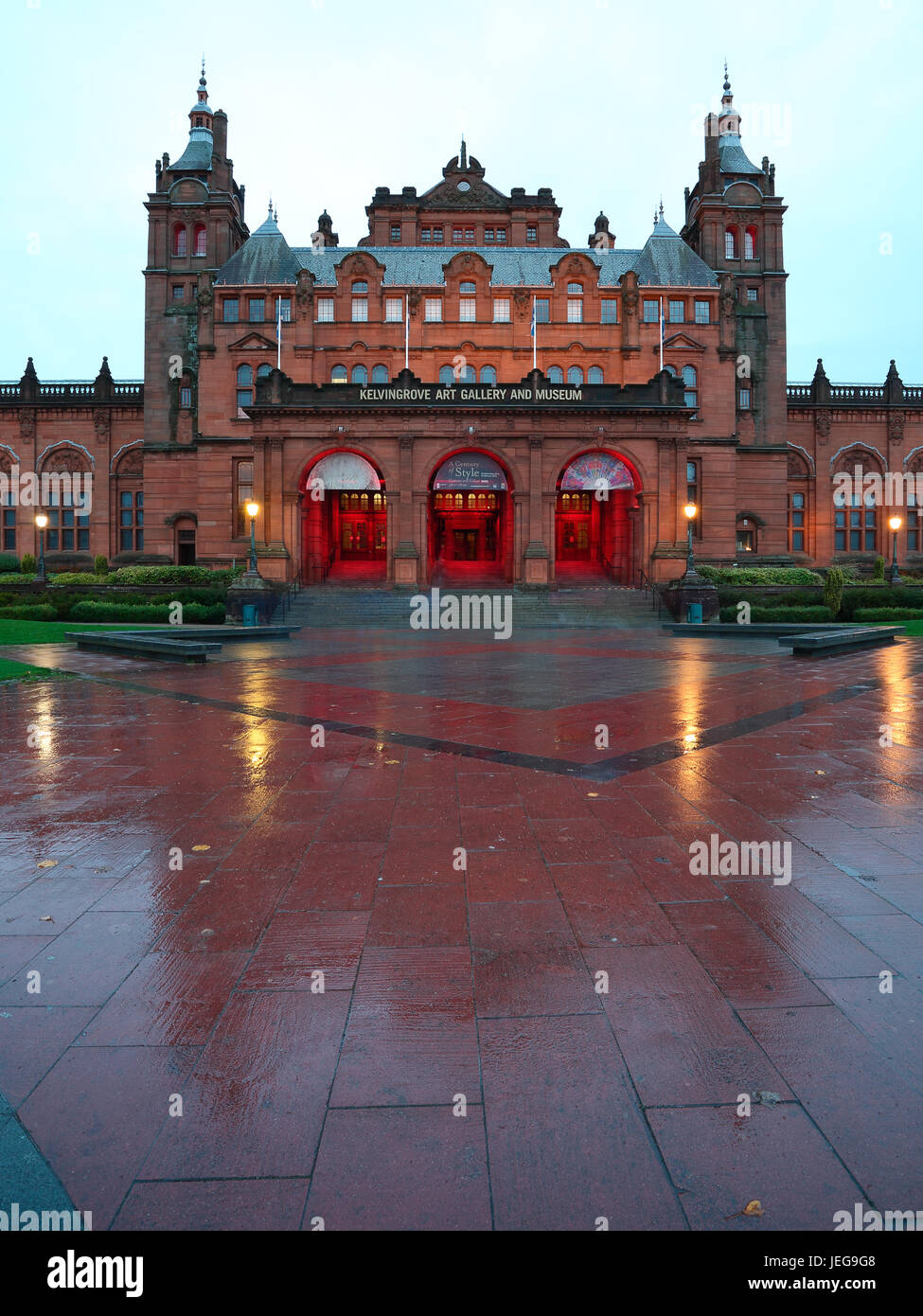 Kelvingrove Art Gallery and Museum reflecting in the pavement after a ...
