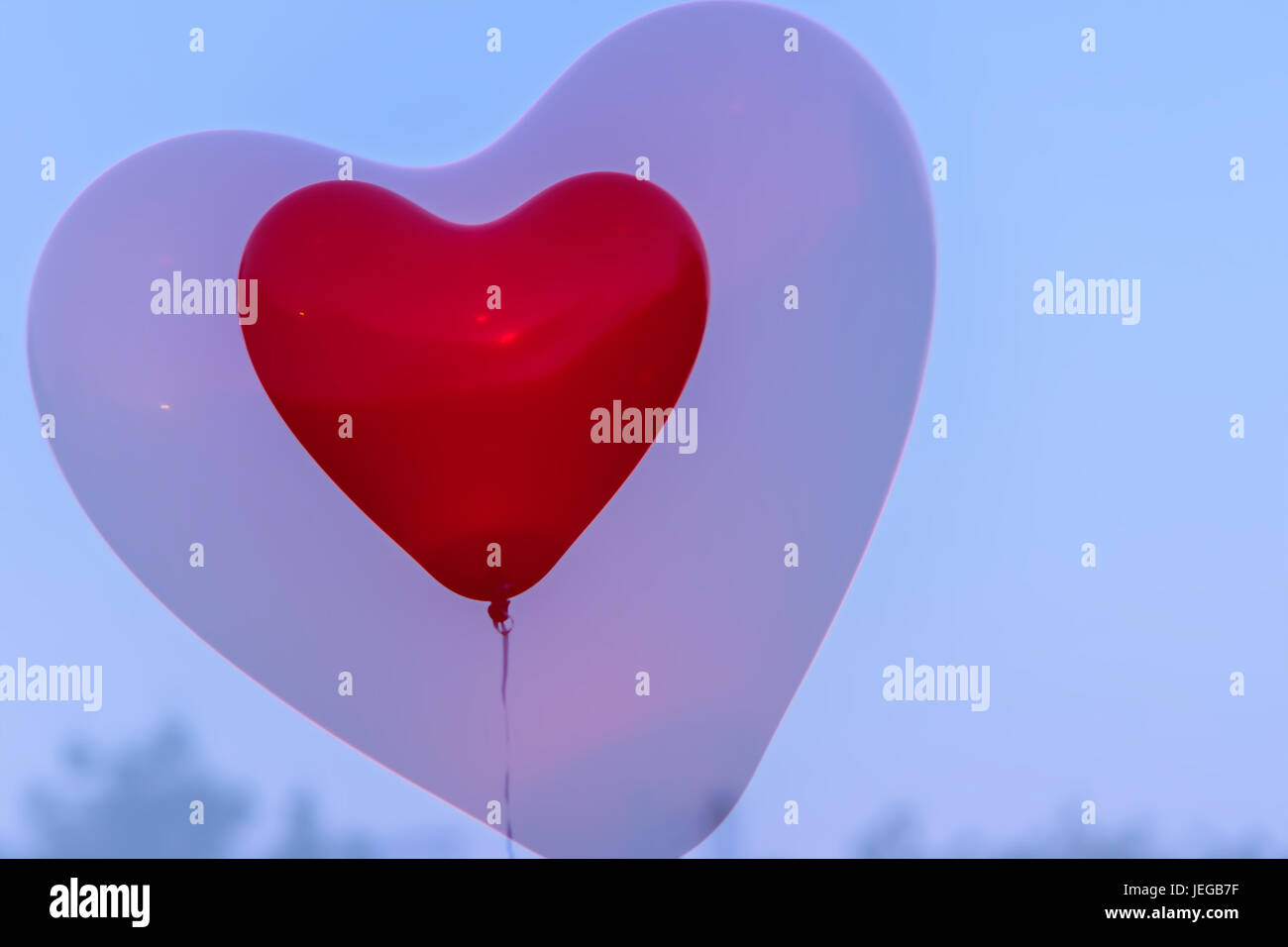 Red LED Balloon in forme Heart and additional silhouette of the heart