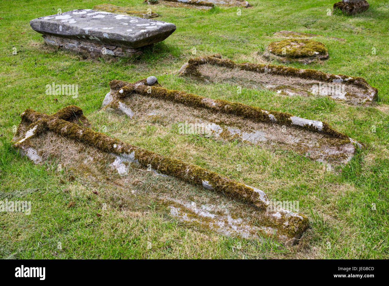 Yorkshire, England, UK.  Medieval Graves in the Cemetery of St. Oswald's Church, Hauxwell, near Leyburn. Stock Photo