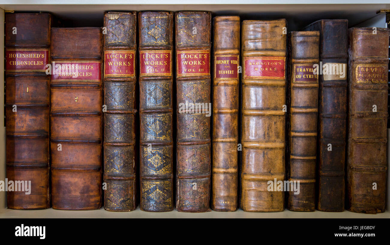 Yorkshire, England, UK.  Antiquarian Books in Library of a Country Estate.  Locke's Works, Holinshed's Chronicles. Stock Photo