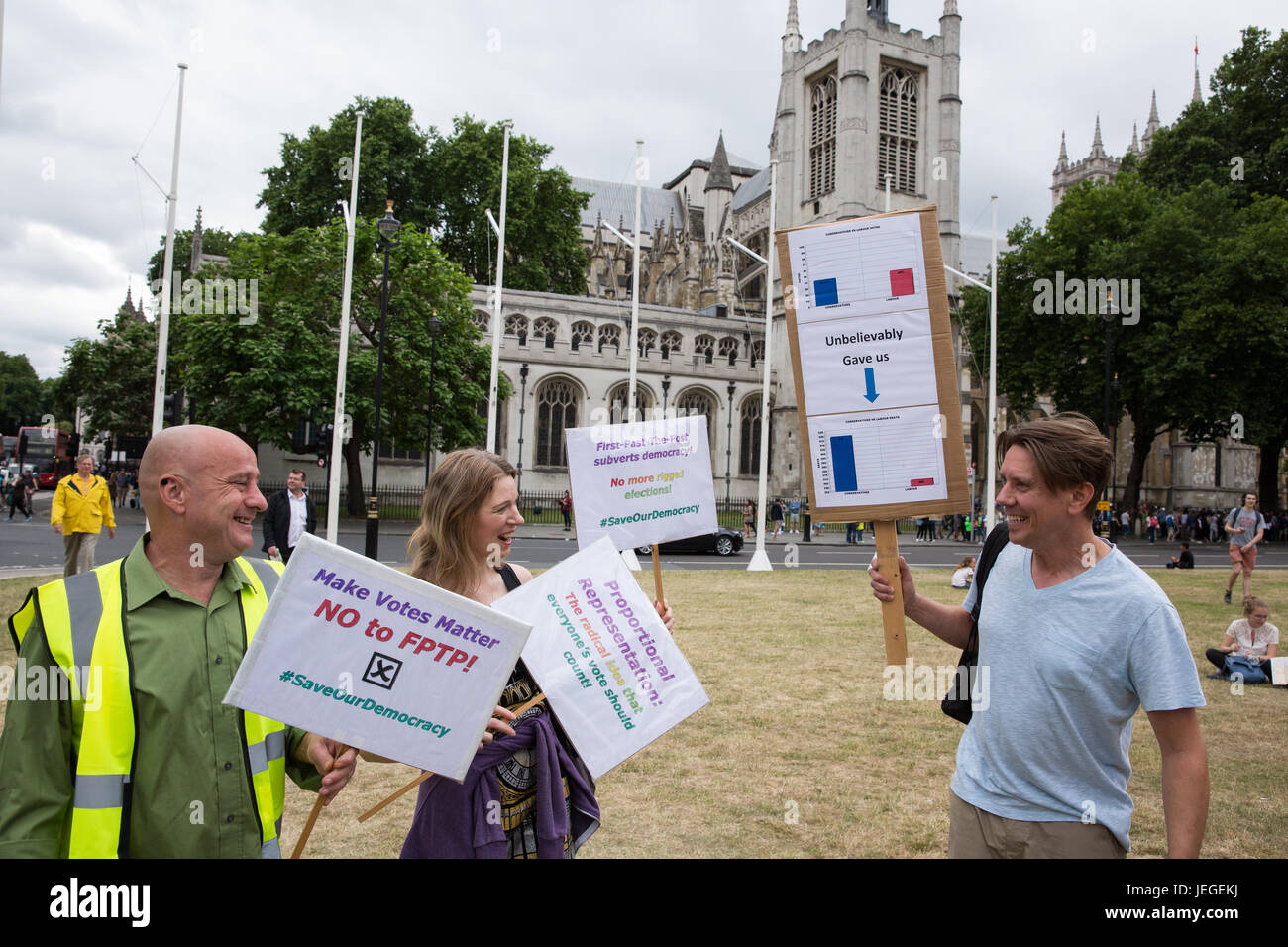 London, UK. 24th June, 2017. Activists hold signs at the Save Our Democracy rally in Parliament Square to call for proportional representation and to plan for the end to the UK's undemocratic first-past-the-post voting system. Credit: Mark Kerrison/Alamy Live News Stock Photo