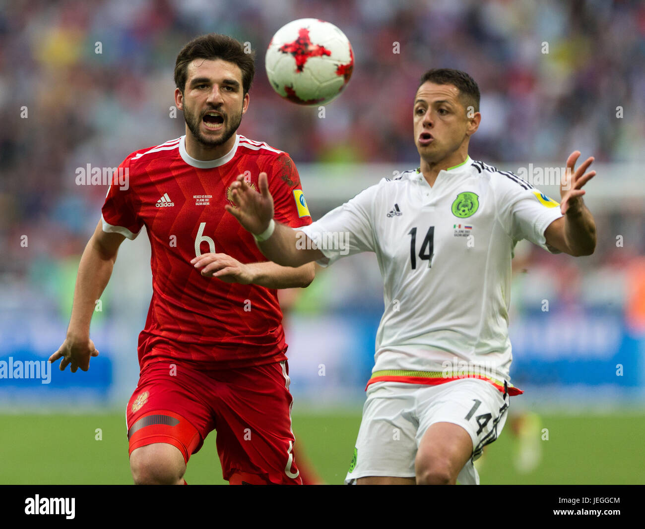 Kazan, Russia. 24th June, 2017. Javier Hernandez of Mexico vies with Georgy Dzhikya(L) of Russia during group A match between Russia and Mexico at the 2017 FIFA Confederations Cup in Kazan, Russia, on June 24, 2017. Mexico won 2-1. Credit: Bai Xueqi/Xinhua/Alamy Live News Stock Photo