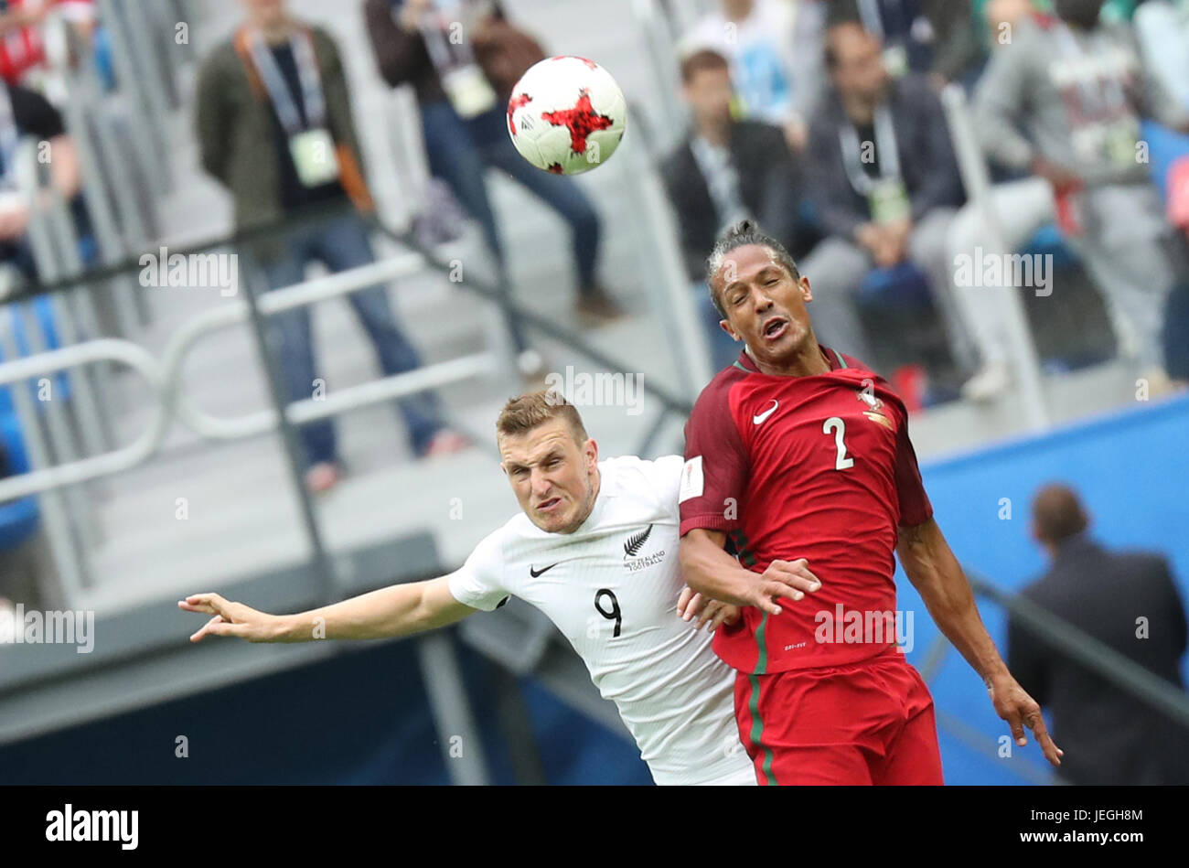 St. Petersburg, Russia. 24th June, 2017. Bruno Alves (R) of Portugal heads the ball with Chris Wood of New Zealand during the group A match between New Zealand and Portugal of the 2017 FIFA Confederations Cup in St. Petersburg, Russia, on June 24, 2017. Portugal won 4-0. Credit: Xu Zijian/Xinhua/Alamy Live News Stock Photo
