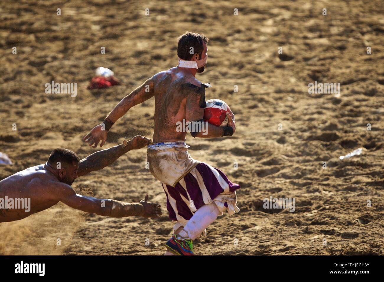 Florence, Italy. 24th June, 2017. Players compete during the final match of the Calcio Storico Fiorentino traditional 16th Century Renaissance ball game at Santa Croce square in Florence, central Italy, June 24, 2017. Calcio Storico Fiorentino, an early form of football from the 16th century, originated from the ancient roman "harpastum". Credit: Jin Yu/Xinhua/Alamy Live News Stock Photo