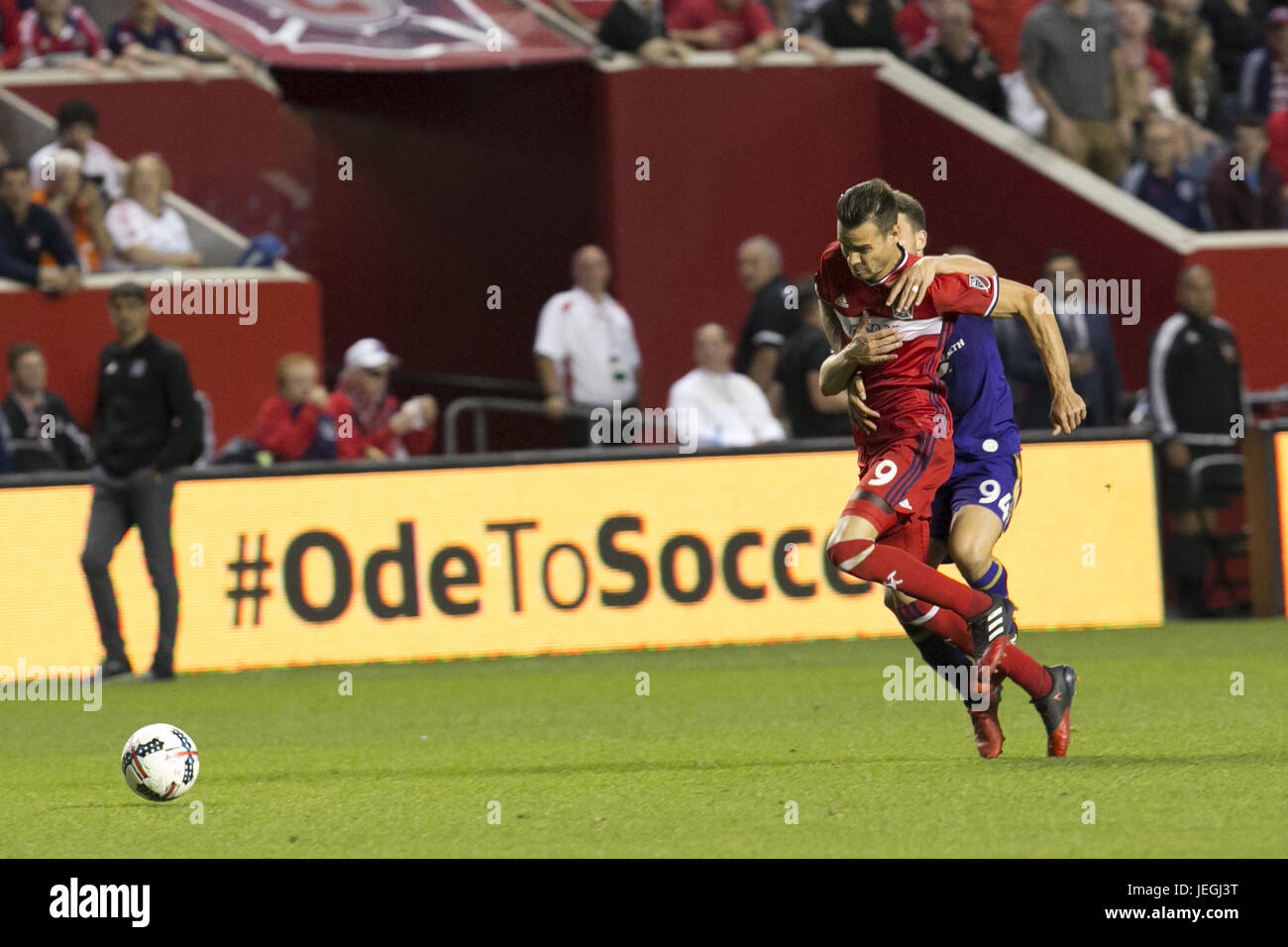 Bridgeview, Illinois, USA. 24th June, 2017. Luis Solignac (9) being pulled down by PC Giro (94) at Toyota Field in Bridgeview Illinois. A yellow card was issued to PC Giro and the Chicago Fire won, 4-0. Credit: Rick Majewski/ZUMA Wire/Alamy Live News Stock Photo