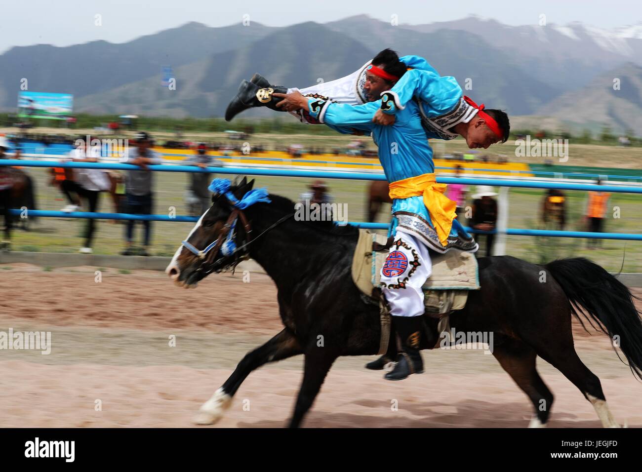 Zhangye, China's Gansu Province. 24th June, 2017. Competitors perform equestrianism during a horse racing event in Sunan County, northwest China's Gansu Province, June 24, 2017. Credit: Cheng Lin/Xinhua/Alamy Live News Stock Photo