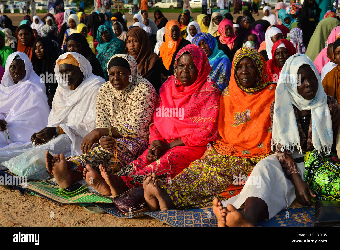 June 25, 2017 - Juba, Jubek, South Sudan - South Sudanese Muslim women pray in an open lot in the Malkei neighborhood of Juba, South Sudan, Sunday in the beginning of Eid al-Fatr, the celebration marking the end of the Muslim holy month of Ramadan. Roughly half the population of South Sudan is Muslim, a legacy of its long domination by the Arab-controlled northern Sudan, which ended in 2011, when South Sudan became the world's newest nation. The country has been in a state of civil war for the past three years, leaving millions of civilians displaced and near famine. (Credit Image: © Miguel Ju Stock Photo