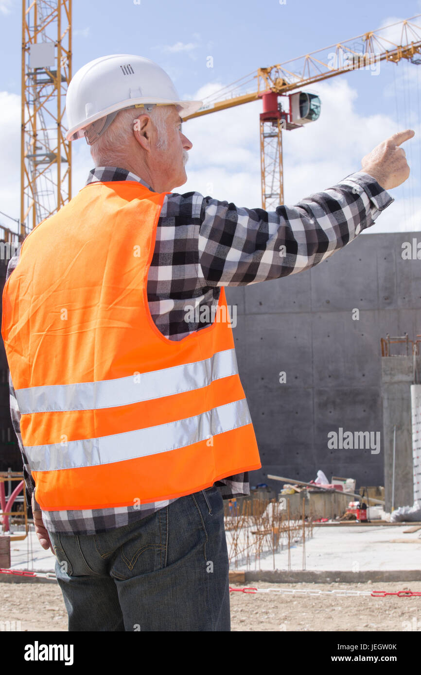 senior construction worker giving directions Stock Photo