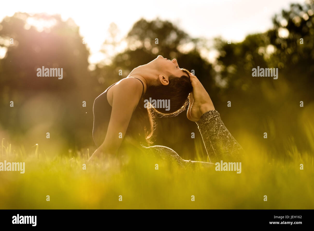 yoga woman on green park Stock Photo