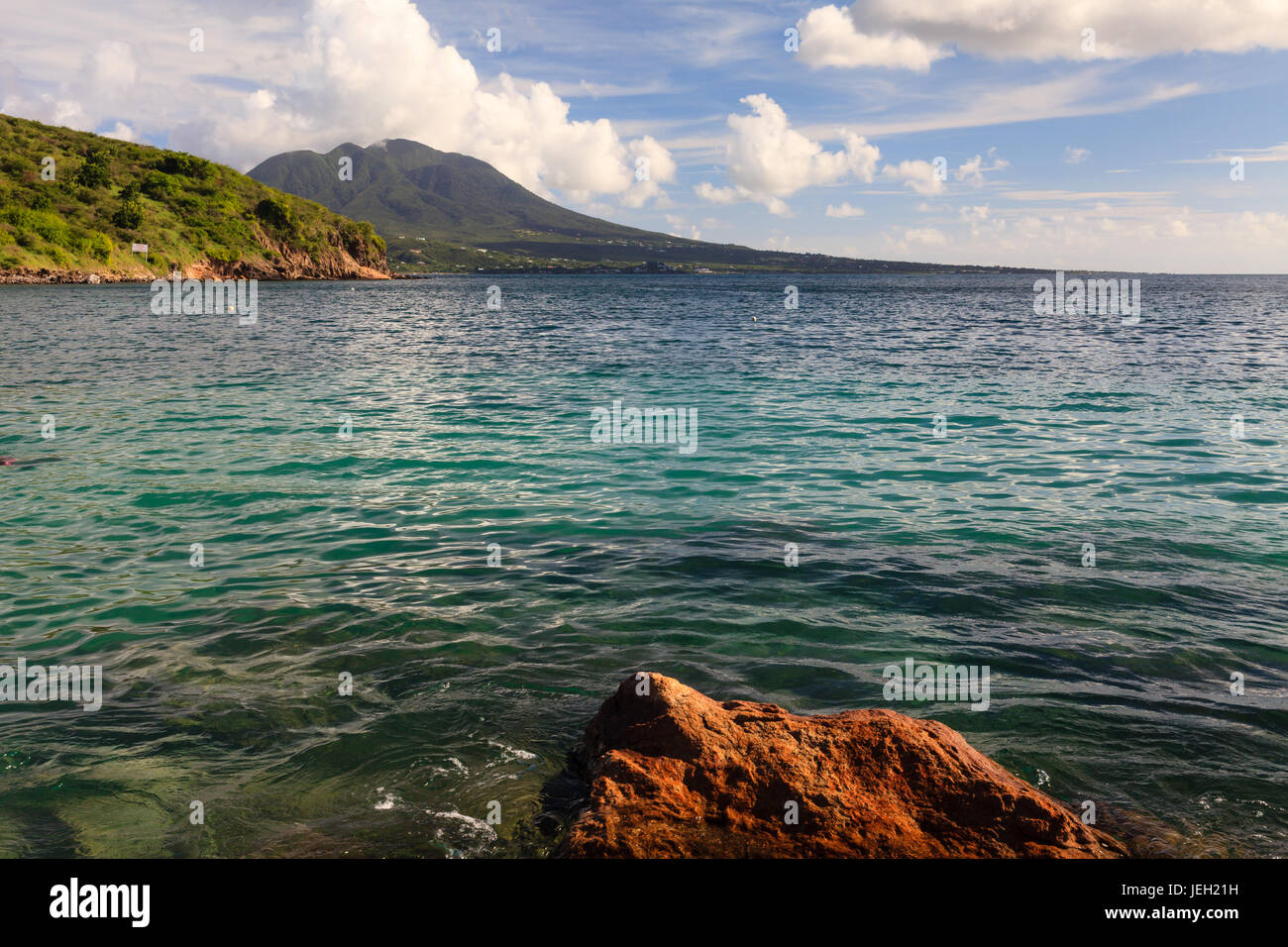 The view from Cockleshell Bay on the Caribbean island of St. Kitts in the West Indies.  The island of Nevis can be seen in the background. Stock Photo