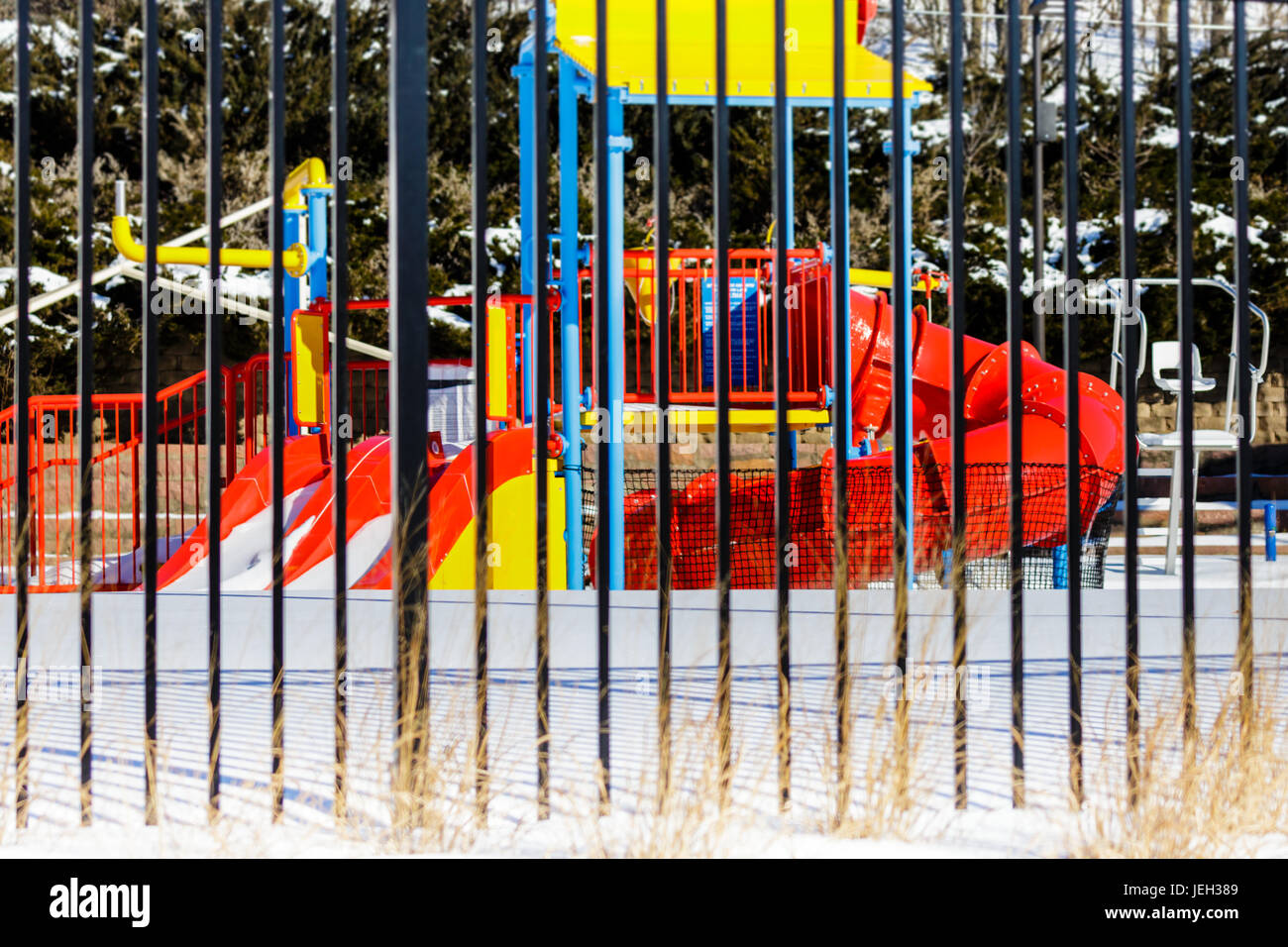 Colorful Wisconsin swimming pool in snow and closed for the winter Stock Photo
