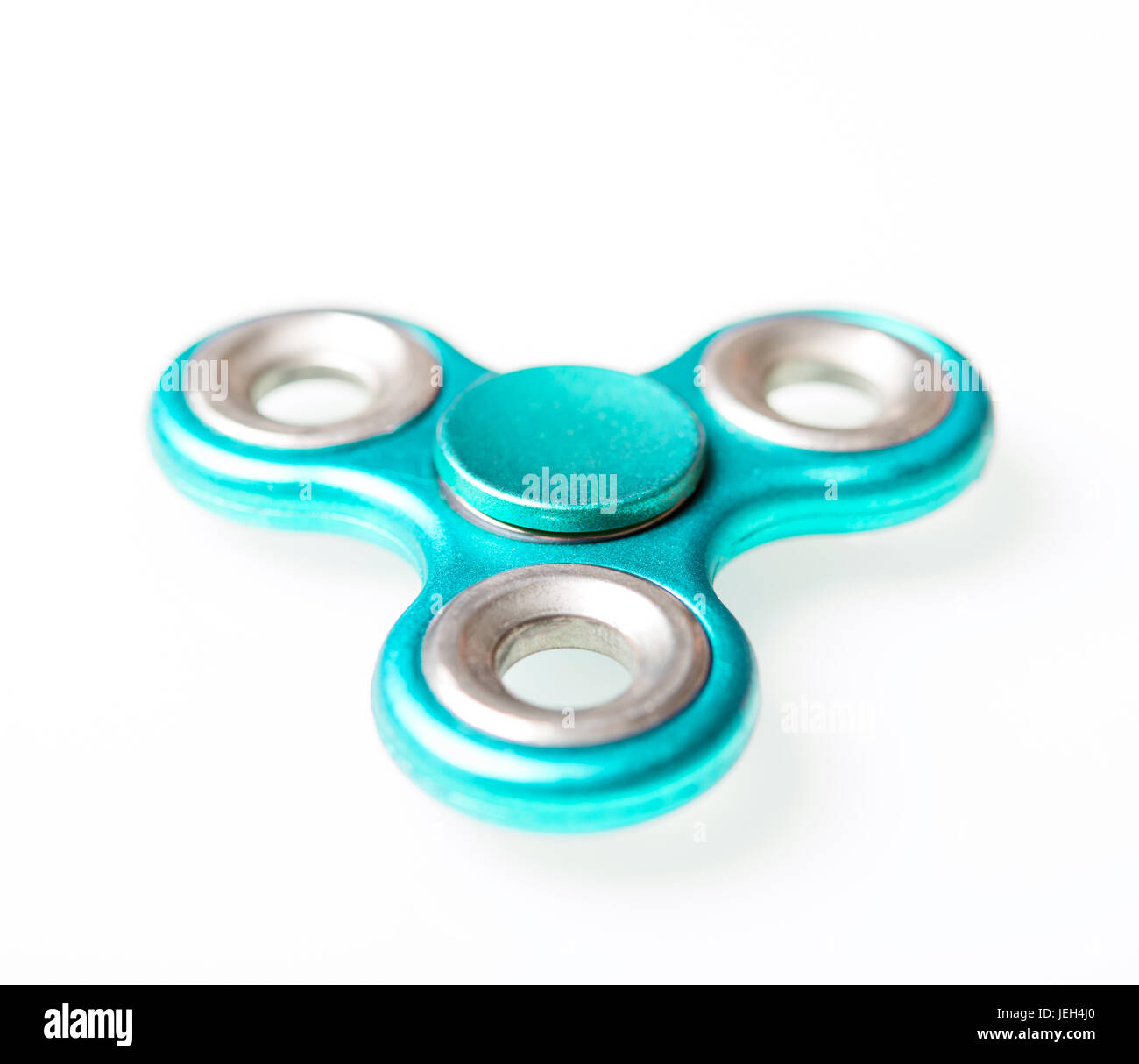 colorful metal spinner on a white background Stock Photo