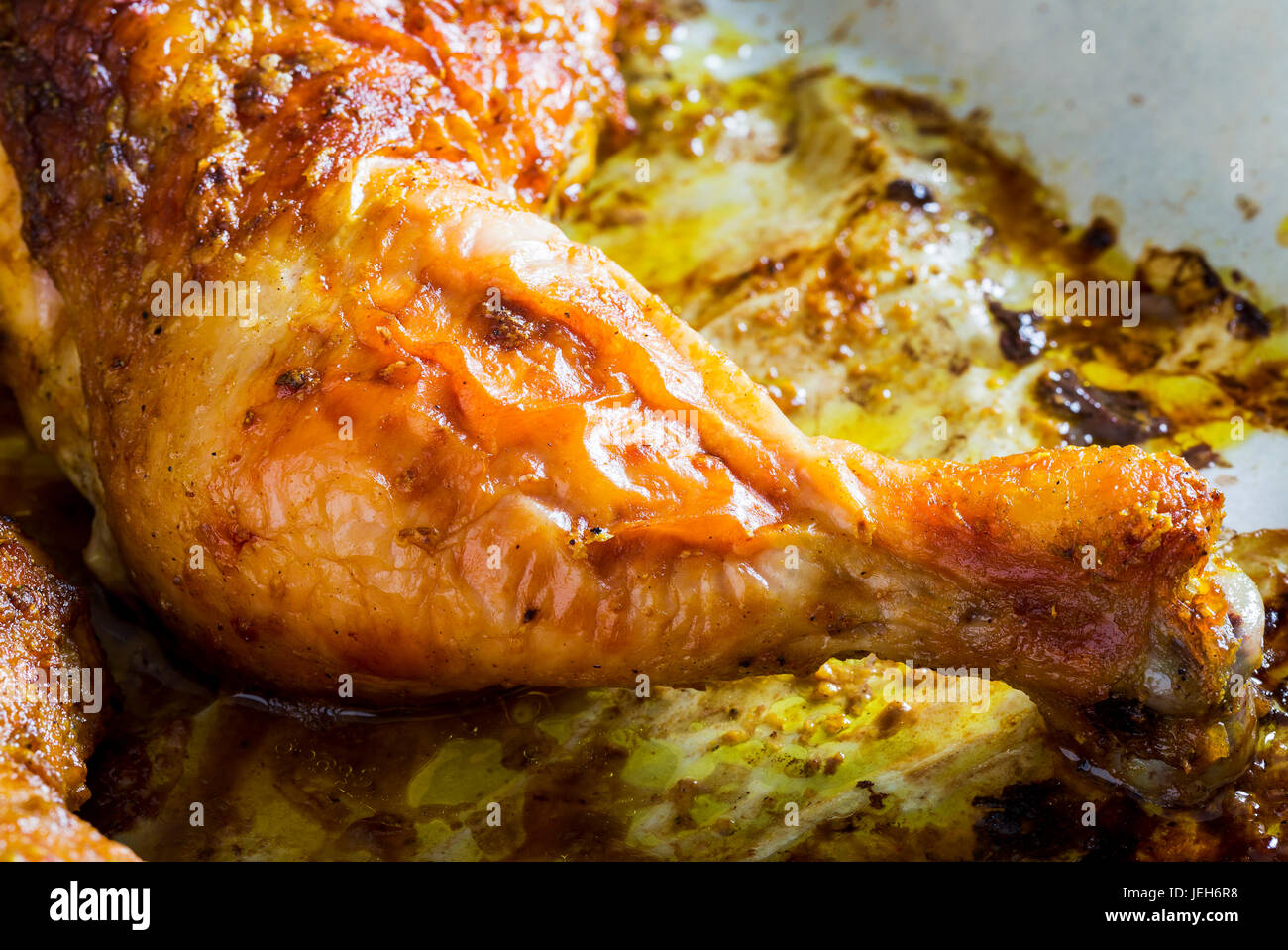 Close-up of a crispy baked chicken leg; Calgary, Alberta, Canada Stock Photo