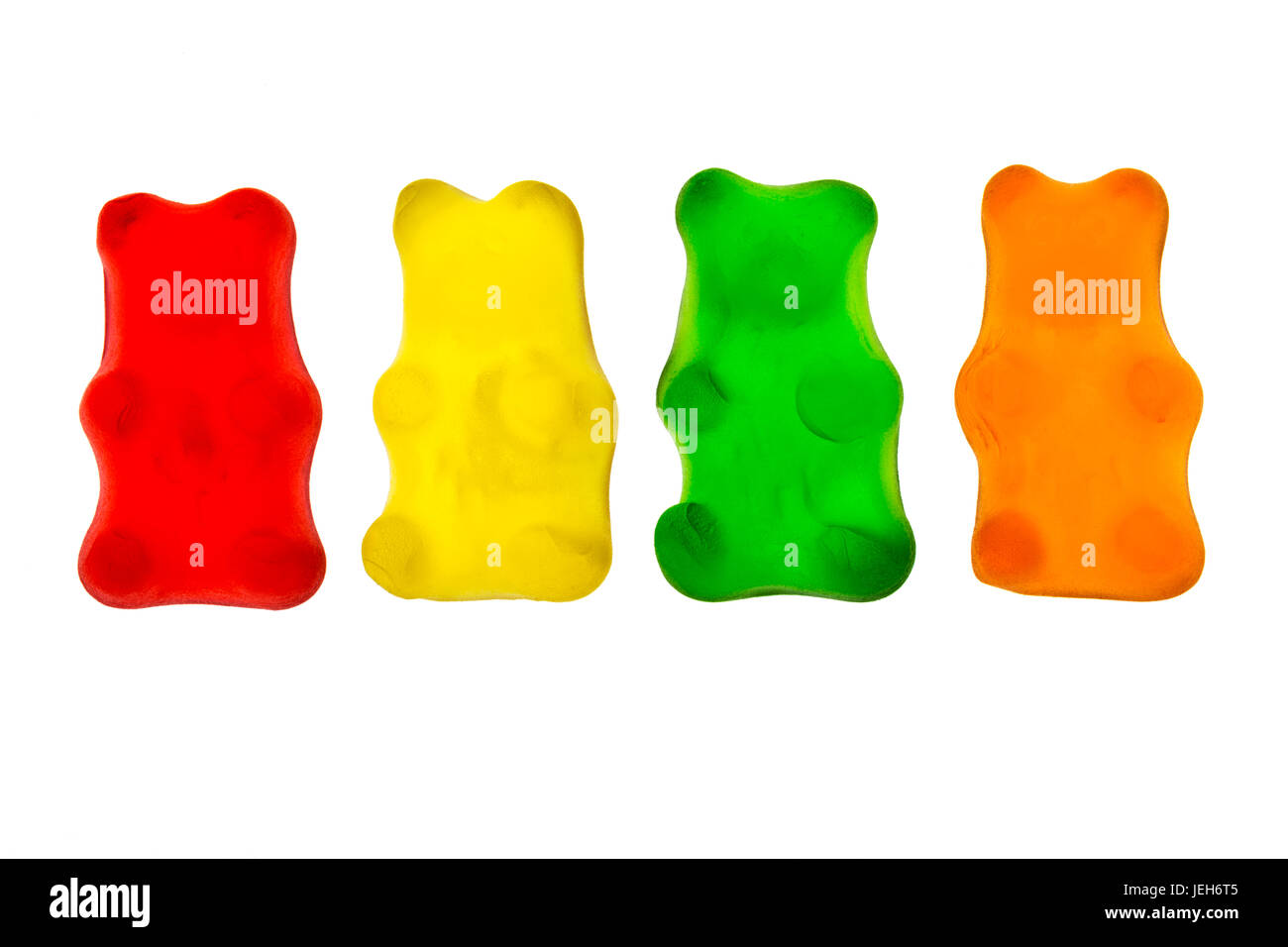 Colourful candied gummy bears in a row backlit; Calgary, Alberta, Canada Stock Photo